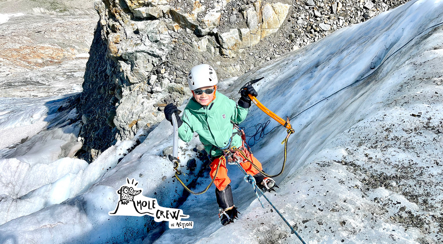 Kid ice climbing in namuk clothing