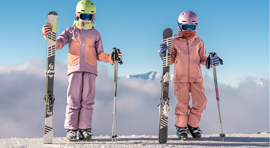 Two children in ski gear on the mountain