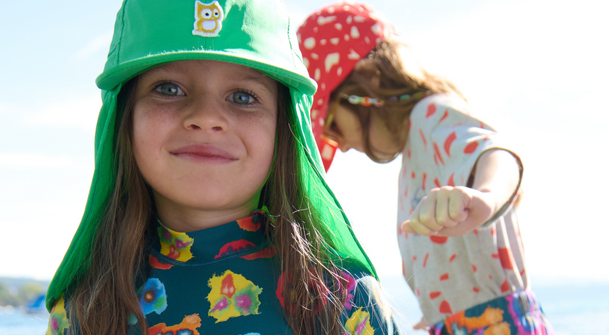Girl in colorful swimwear looking directly at the camera