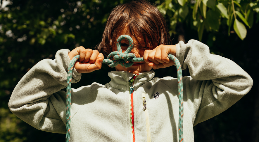 Arlo binds an alpine butterfly knot with a rope
