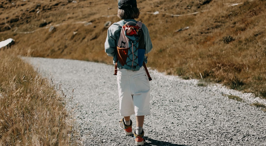 Kid in namuk clothing hiking
