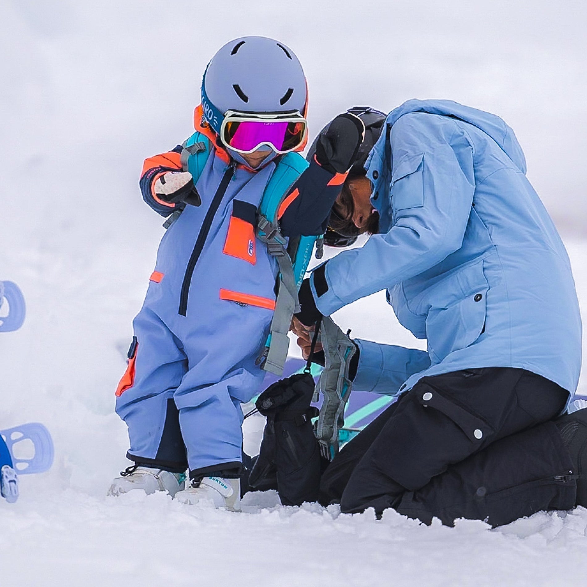 How do I teach my child to snowboard?